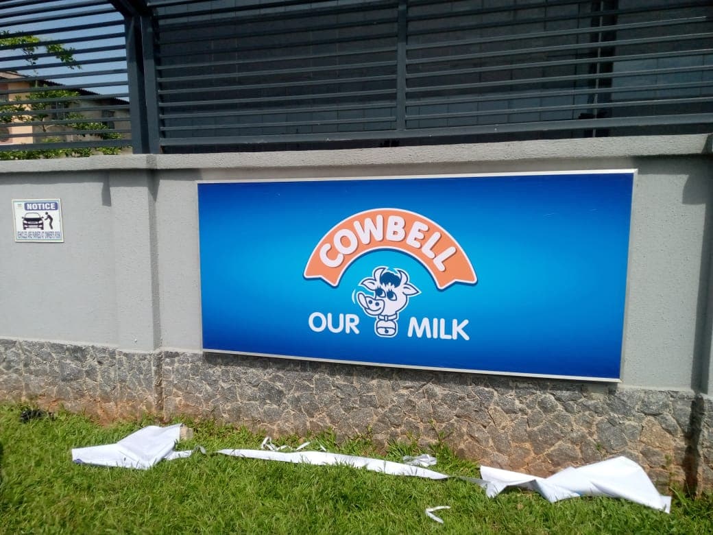 Cowbell — "Our Milk" framed wall sign, freshly installed.