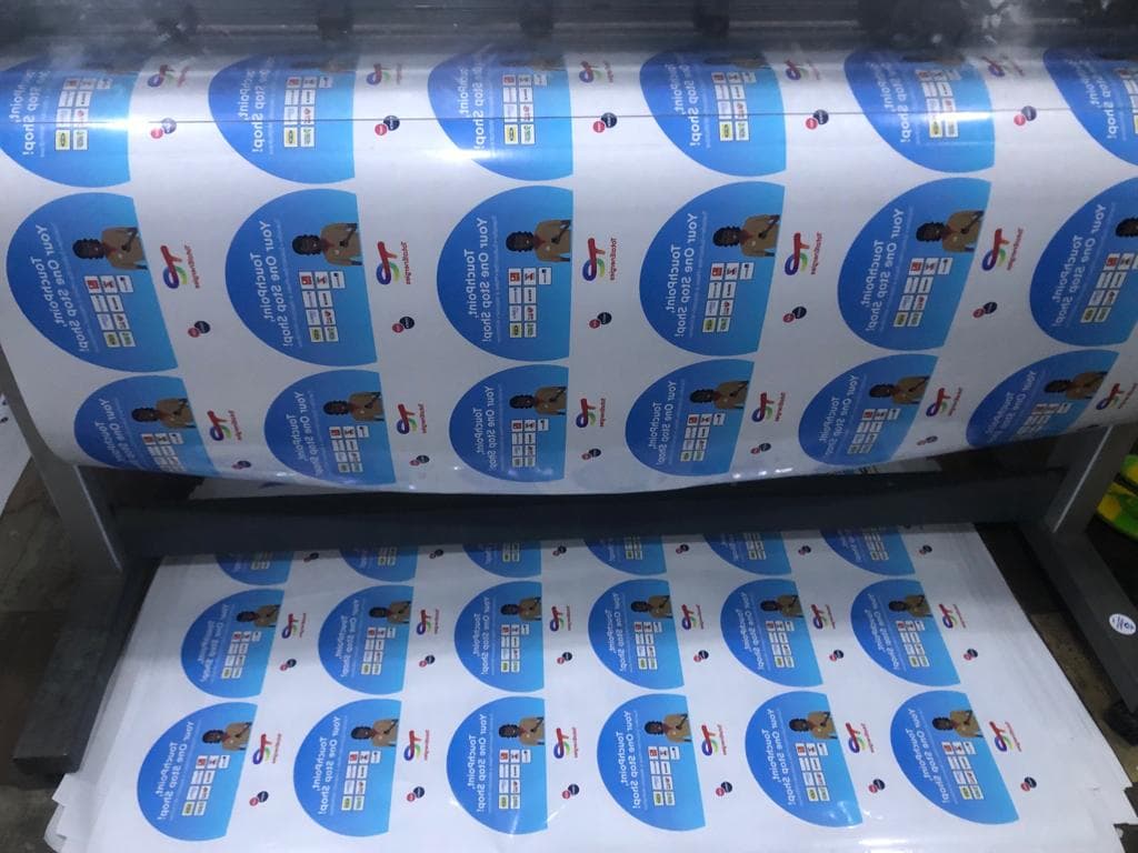 TotalEnergies — Decals on the large-format press mid-run.