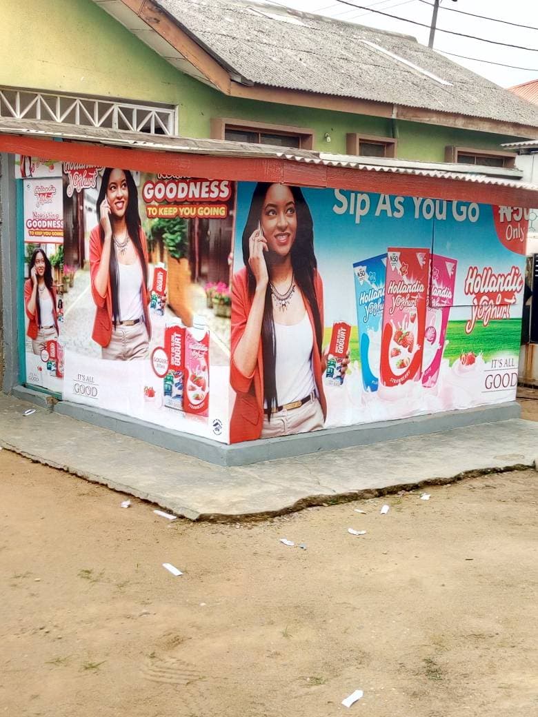 Hollandia — Corner shop wrap turning two elevations.